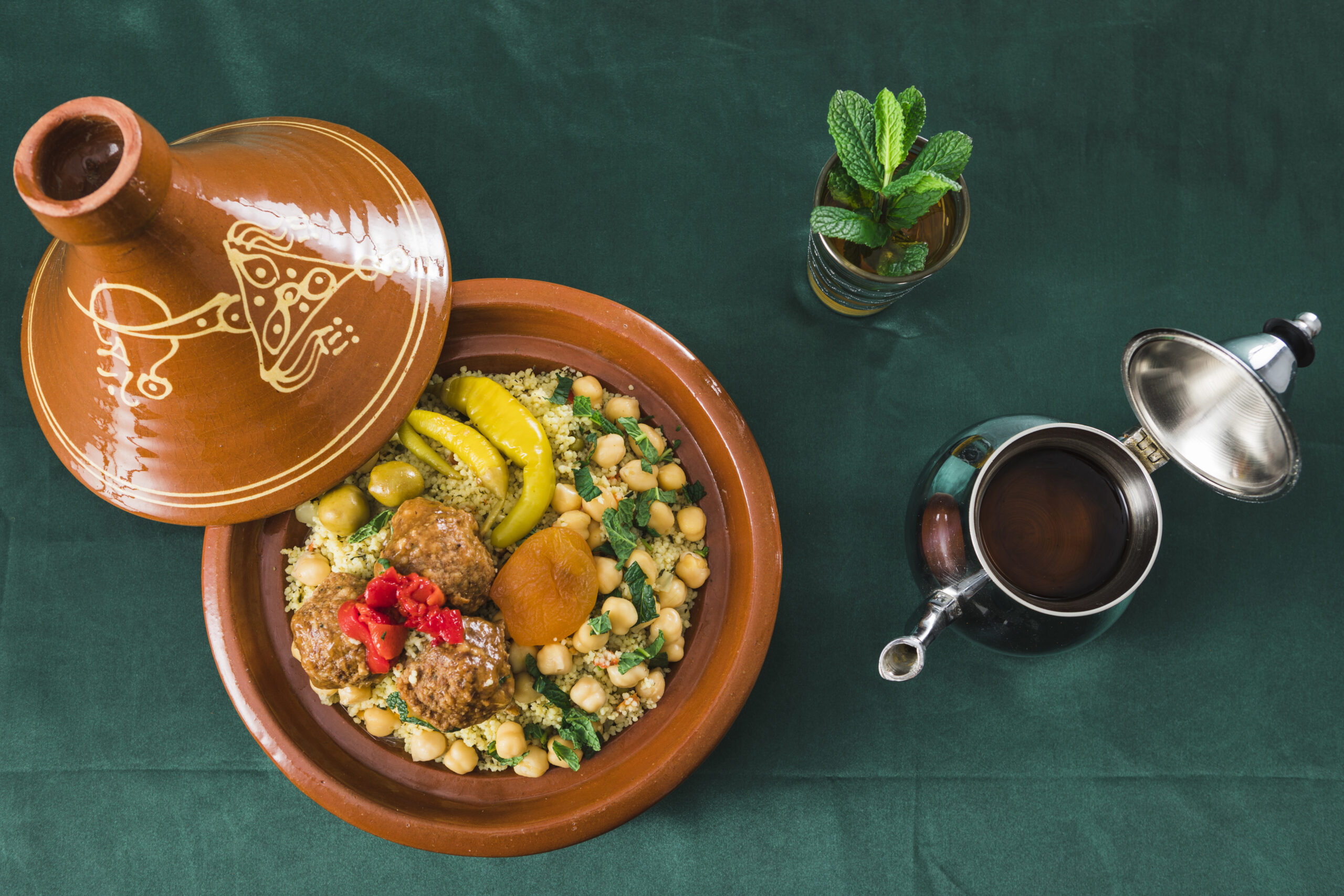 plate-with-food-near-cup-drink-teapot